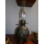 A 19th century ornate spelter oil lamp