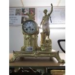 A good quality gilded mantel clock surmounted figure