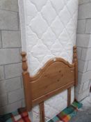 A single mattress and headboard