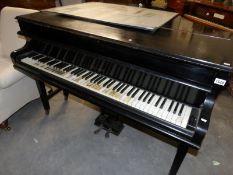 A Challen baby grand piano