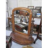 A mahogany toilet mirror