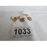 A pair of 9ct gold cuff links hall marked Chester 1894 and a 9ct gold tie tack