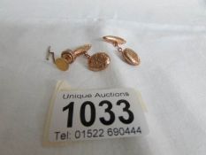 A pair of 9ct gold cuff links hall marked Chester 1894 and a 9ct gold tie tack