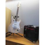 An electric guitar set including Strat style guitar,