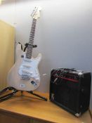 An electric guitar set including Strat style guitar,