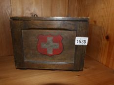 A vintage first aid box and contents