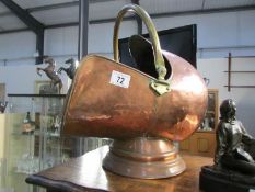 A copper 'helmet' coal scuttle