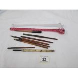 A quantity of old dip pens and 2 twisted glass items