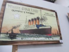 A painted sign of the Titanic on pine boards