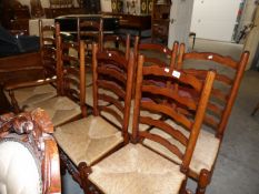 A set of 8 ladder back chairs