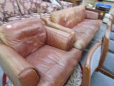 A brown leather sofa and chair