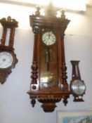 A mahogany twin weight Vienna wall clock