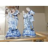 A pair of blue and white German figure groups,