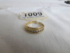 A 9ct gold ring set 9 diamonds,