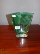 A green etched glass vase