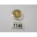 A gold £5 Royal Mint proof first day cover coin,