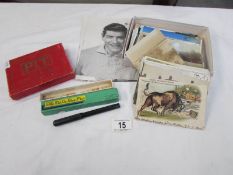 A quantity of old postcards, theatre programmes (1 signed),