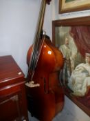 A Boosey & Hawks double bass with bow (Student Model)
