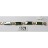 A jade and floral gilt bracelet