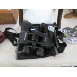 A cased pair of Bresser 10 x 50 binoculars