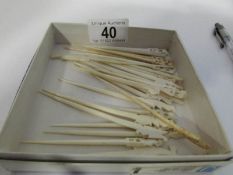 26 ivory cocktail sticks,