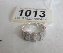 An 18ct white gold ring set 85pt baguette and brilliant diamonds