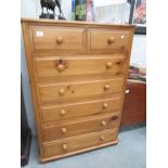 A pine 2 over 5 chest of drawers