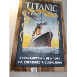 A painted sign of the Titanic on pine boards