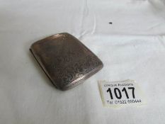 A silver cigarette case,