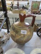 An early 19th century terracotta Morragon oil jug