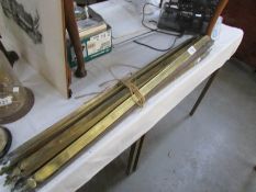 A set of brass stair rods