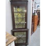 An astragal glazed corner cabinet