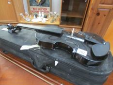 A cased violin and bow