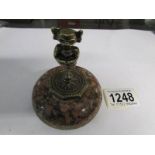 A brass Lincoln imp paper weight with granite base