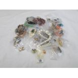 A mixed lot of costume jewellery including necklaces and earrings