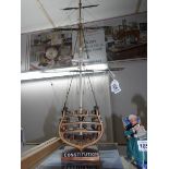 A hand built 'cut part' model of 'USS Constitution' with book