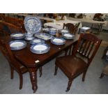 A mahogany dining table and 4 chairs