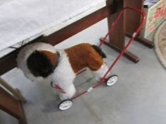 A push along dog toy