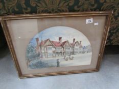 A framed and glazed print of a manor house
