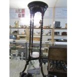 A mahogany torchere