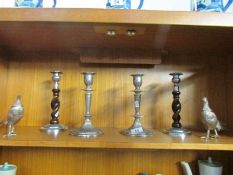 2 pairs of candlesticks and a pair of silver plated figures