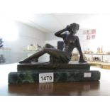 A Bronze reclining figure