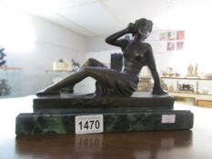 A Bronze reclining figure