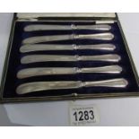 A cased set of 6 silver handled butter knives