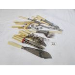 A quantity of fish knives and forks