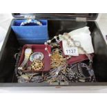 A lacquered box of costume jewellery including watches, some silver,