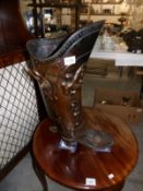 A boot shaped stick stand