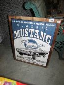 A painted Ford Mustang sign on pine boards