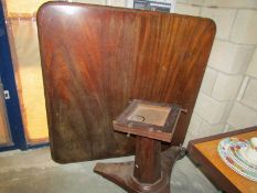 A large square Victorian mahogany table for restoration