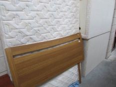 A double divan bed with headboard